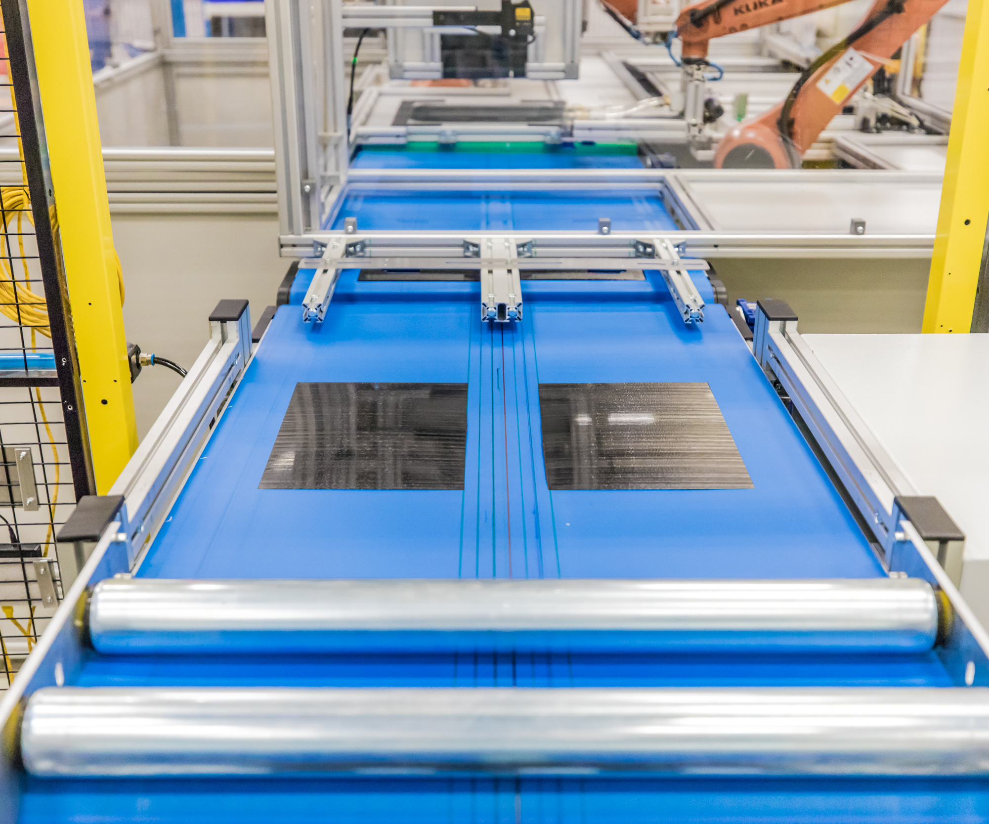 Rapid, Precision Thermoplastic Composite Manufacturing with Conveyor‑Based Layup